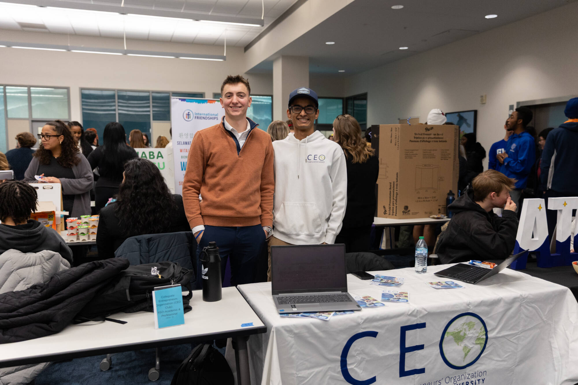 CEO club members smiling at their table.